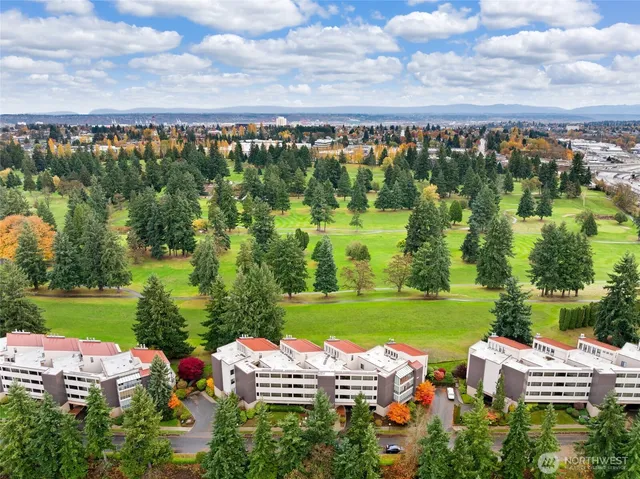 an aerial view of a house with garden space and outdoor seating