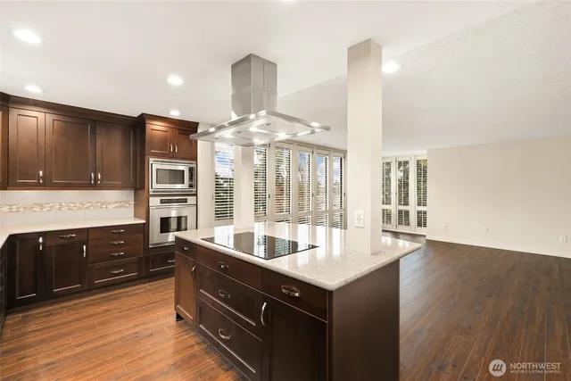 a kitchen with counter top space and sink