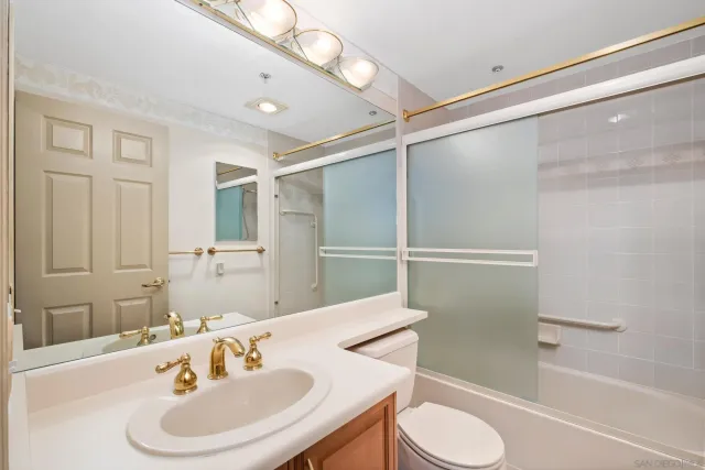 a view of walk in closet with empty room