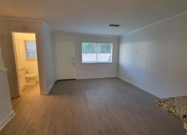 a kitchen with granite countertop a stove and a sink