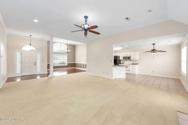 a view of a kitchen with a sink and a window