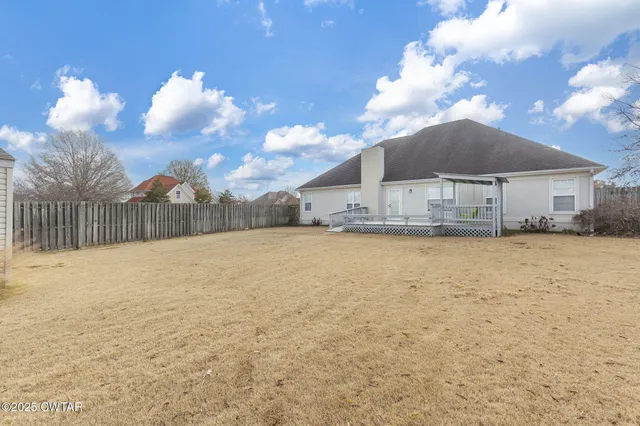 a view of a house with a snow in the yard