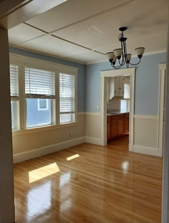 204 Eastern Avenue Lynn, MA 01902 - Photo 6 of 16 a view of empty room with wooden floor and fan