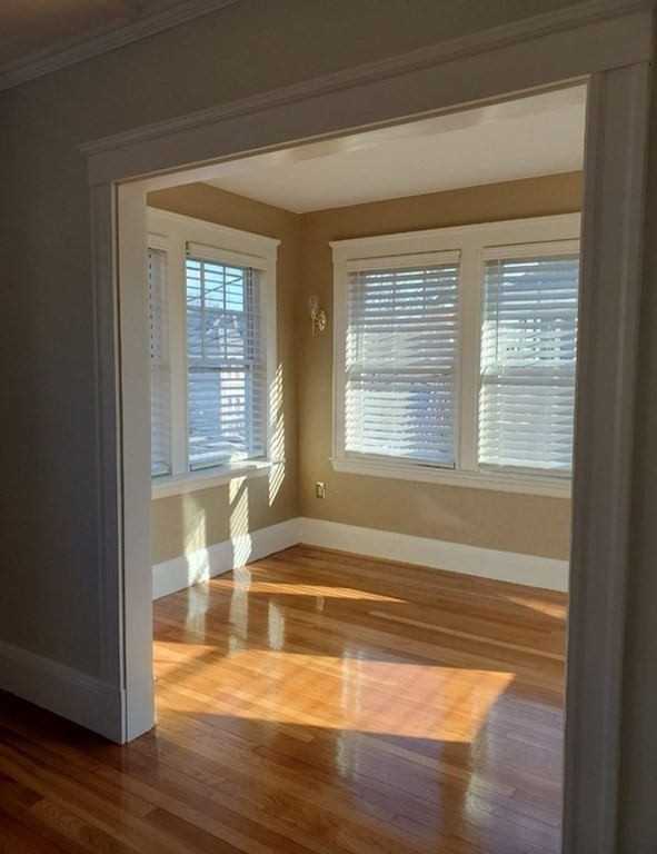 204 Eastern Avenue Lynn, MA 01902 - Photo 10 of 16 a view of empty room with wooden floor and fan