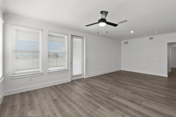 a view of a kitchen with a sink and wooden floor