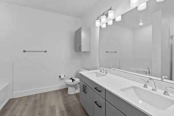 a bathroom with a bathtub and a shower