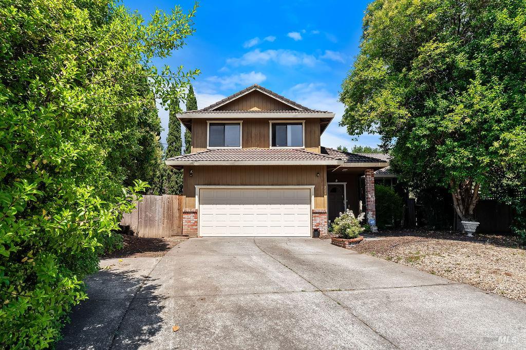715 Placer Court Santa Rosa, CA 95401 - Photo 5 of 37 a front view of a house with a yard and garage