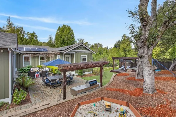 a view of a big yard with large trees