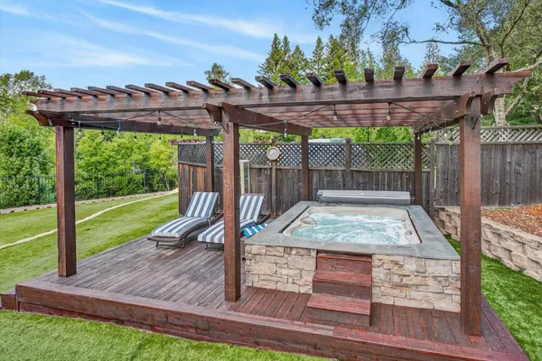 swimming pool view with a seating space