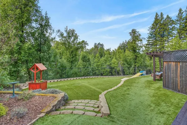 a outdoor living space with patio furniture and potted plants