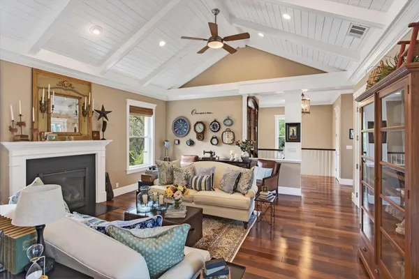a kitchen with a stove a table and chairs in it