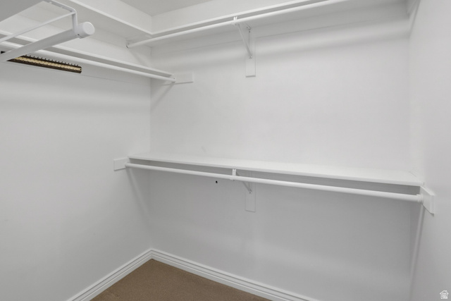 2190 750 West Perry, UT 84302 - Photo 30 of 42 Walk-in closet with white shelving and hanging rods