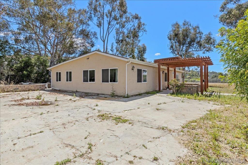 5461 Rainbow Creek Road Fallbrook, CA 92028 - Photo 6 of 28 a front view of a house with garden