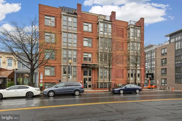 a view of a cars parked in front of a building