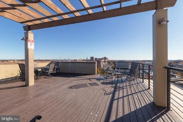 a view of a balcony with wooden floor
