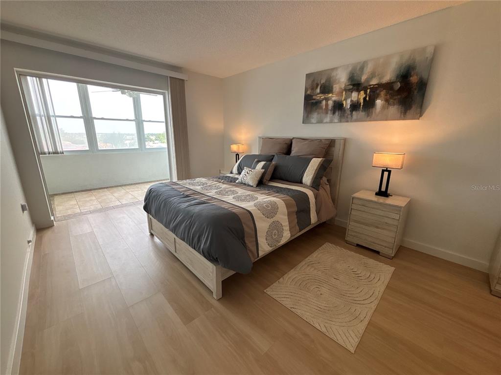 4725 Cove Circle, Unit 405 St. Petersburg, FL 33708 - Photo 9 of 23 a bedroom with a bed and window
