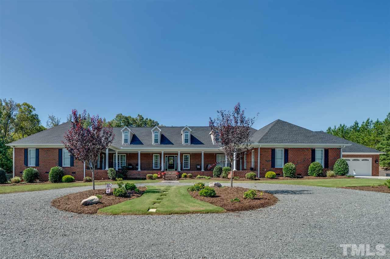 2256 Sanders Road Stem, NC 27581 - Photo 1 of 29 front view of a house with a yard