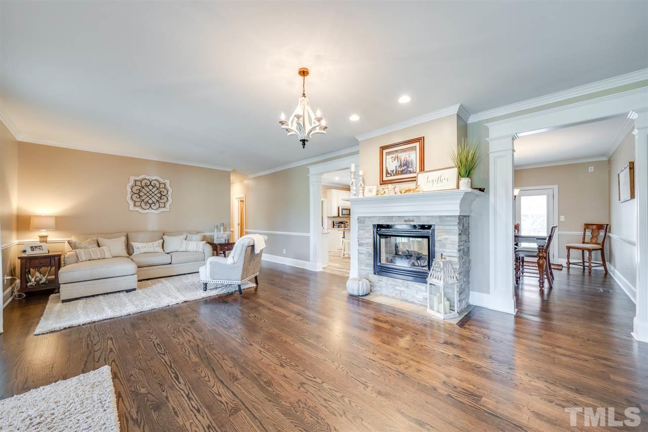 2256 Sanders Road Stem, NC 27581 - Photo 2 of 29 a living room with furniture and a fireplace