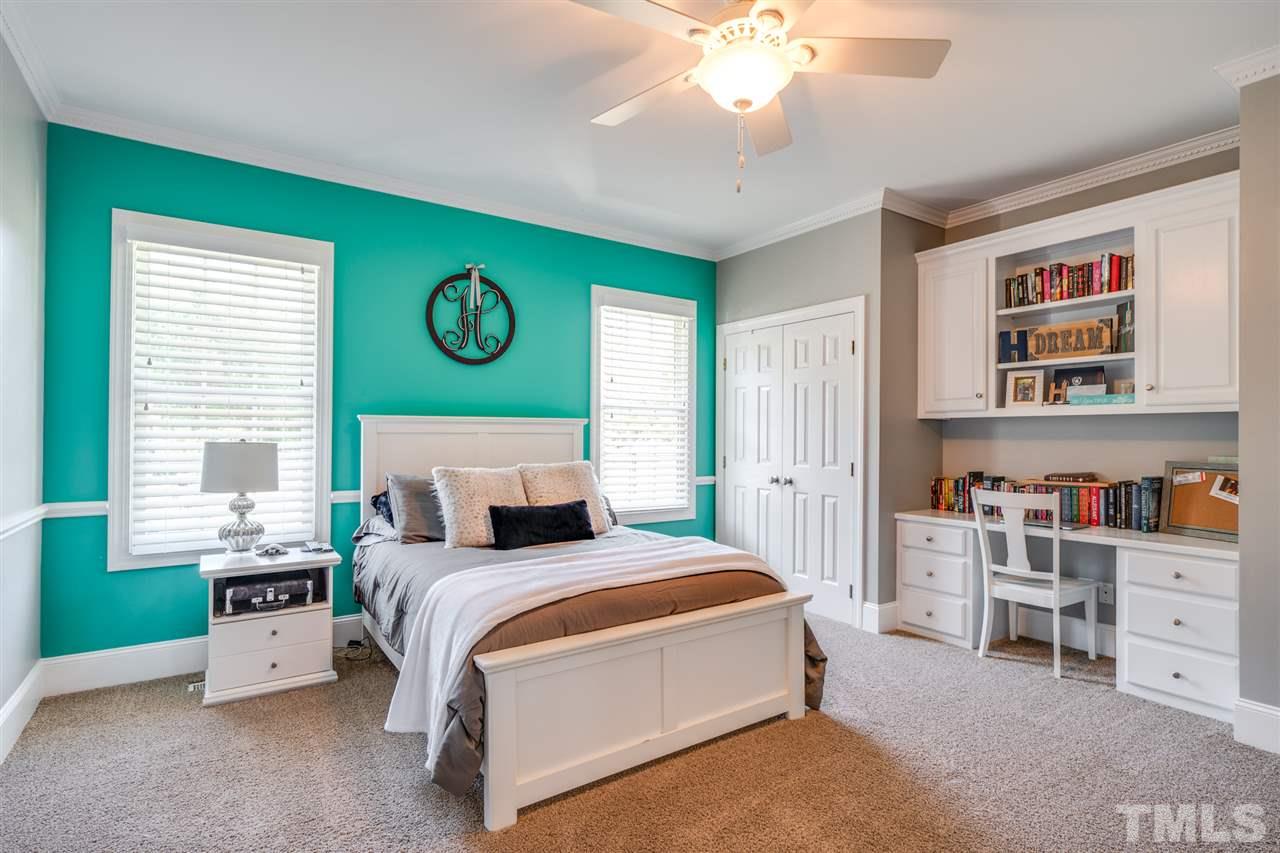 2256 Sanders Road Stem, NC 27581 - Photo 14 of 29 a bed room with a bed and a window