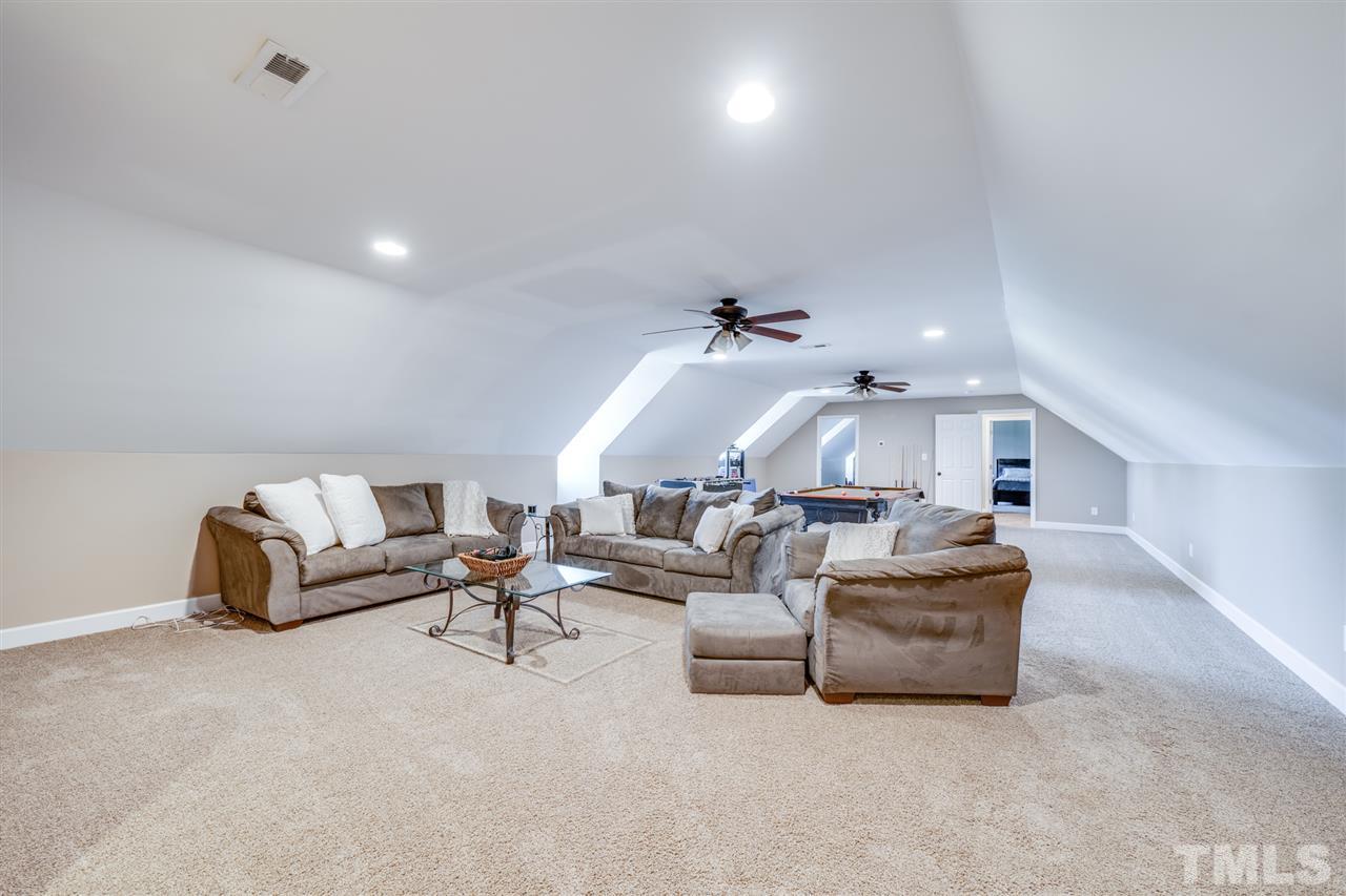 2256 Sanders Road Stem, NC 27581 - Photo 19 of 29 a living room with furniture and white walls