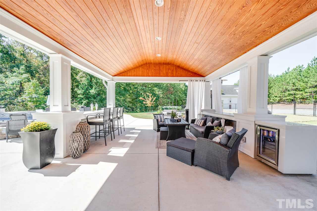 2256 Sanders Road Stem, NC 27581 - Photo 23 of 29 a living room with furniture and garden view