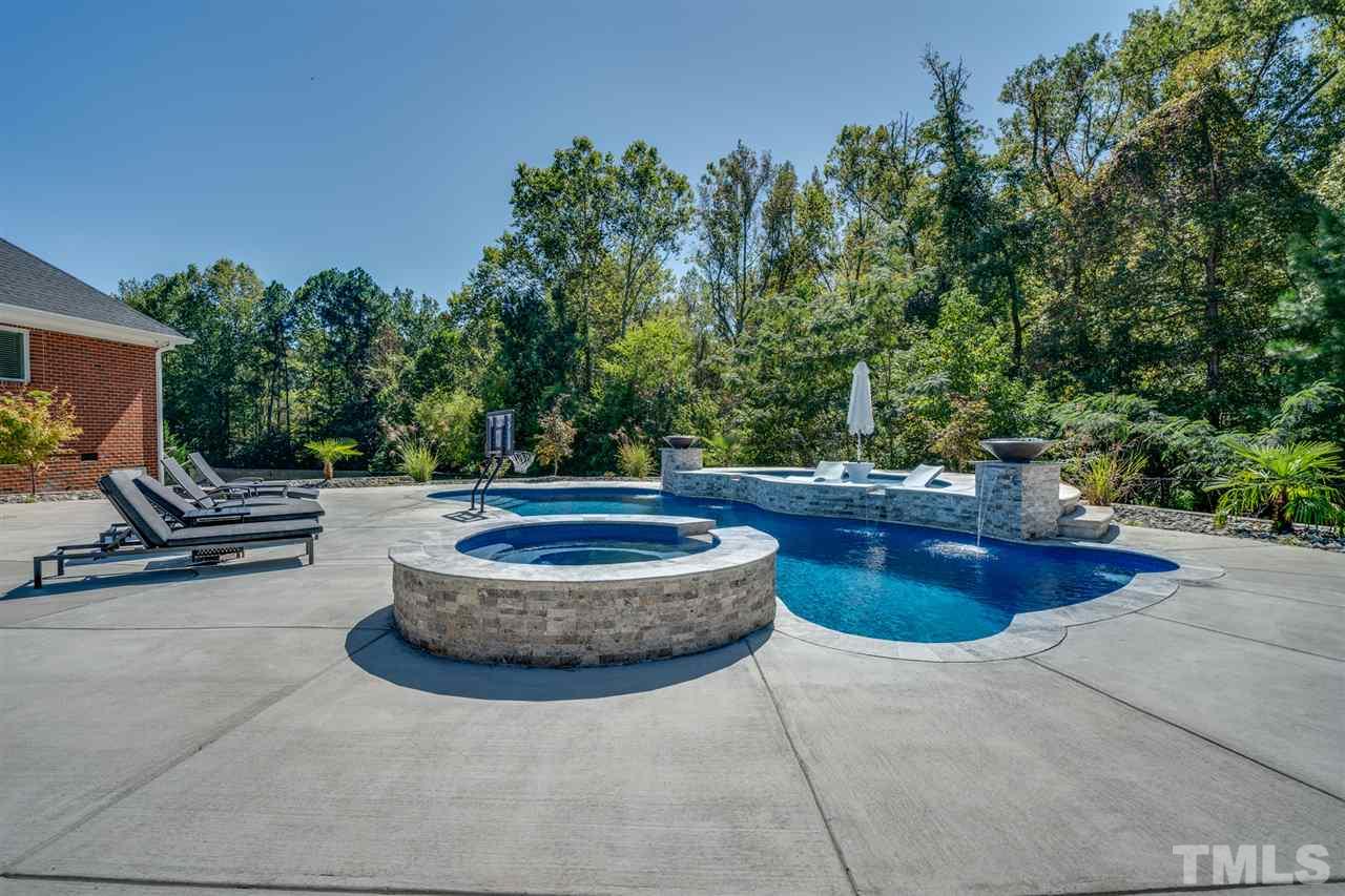 2256 Sanders Road Stem, NC 27581 - Photo 24 of 29 a outdoor space with pool and furniture