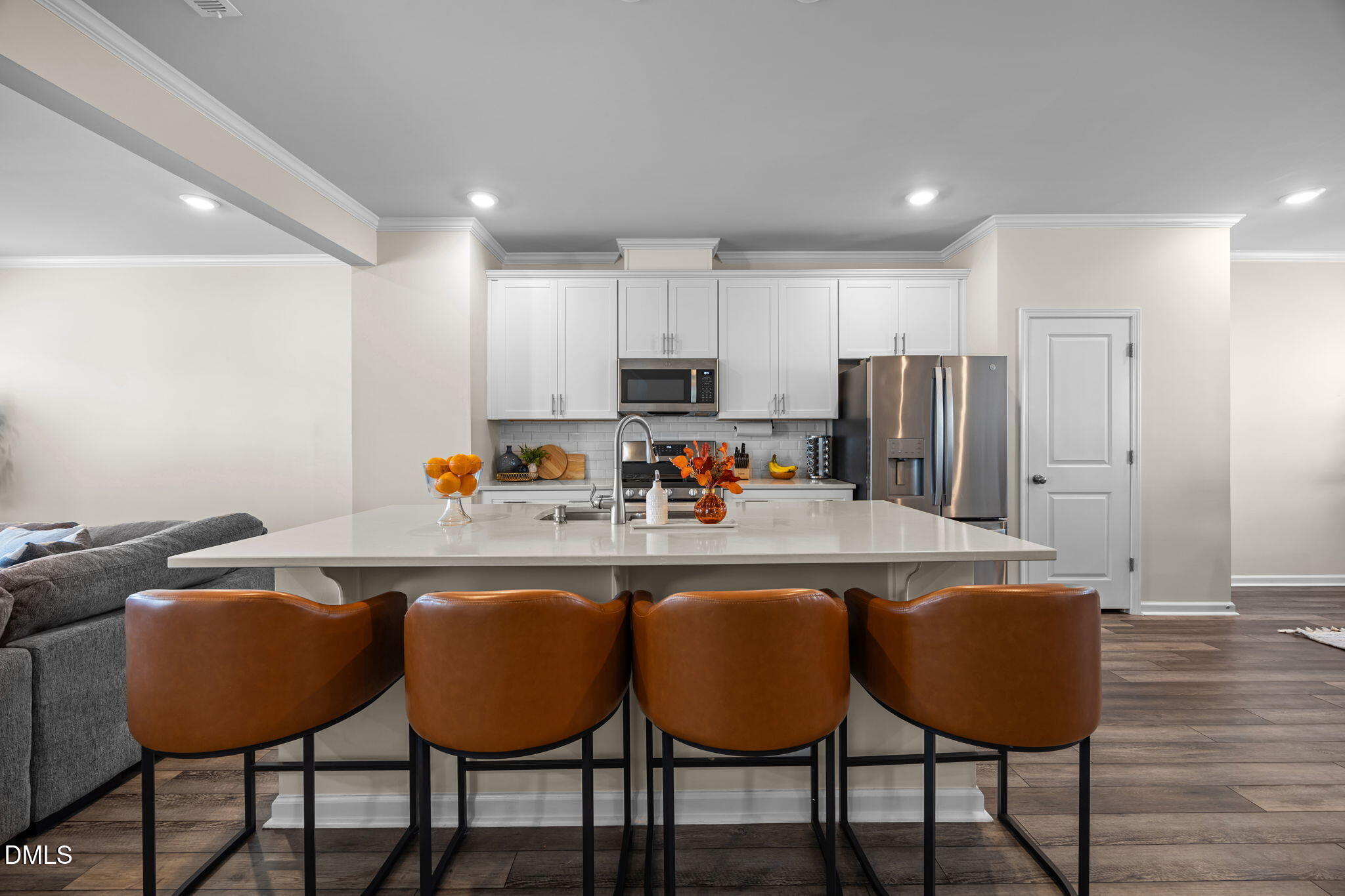 6414 Nurture Avenue Raleigh, NC 27616 - Photo 15 of 36 a kitchen with stainless steel appliances granite countertop a dining table chairs refrigerator and sink