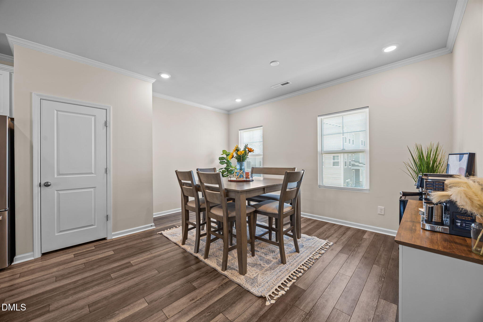 6414 Nurture Avenue Raleigh, NC 27616 - Photo 17 of 36 a view of a dining room with furniture and wooden floor