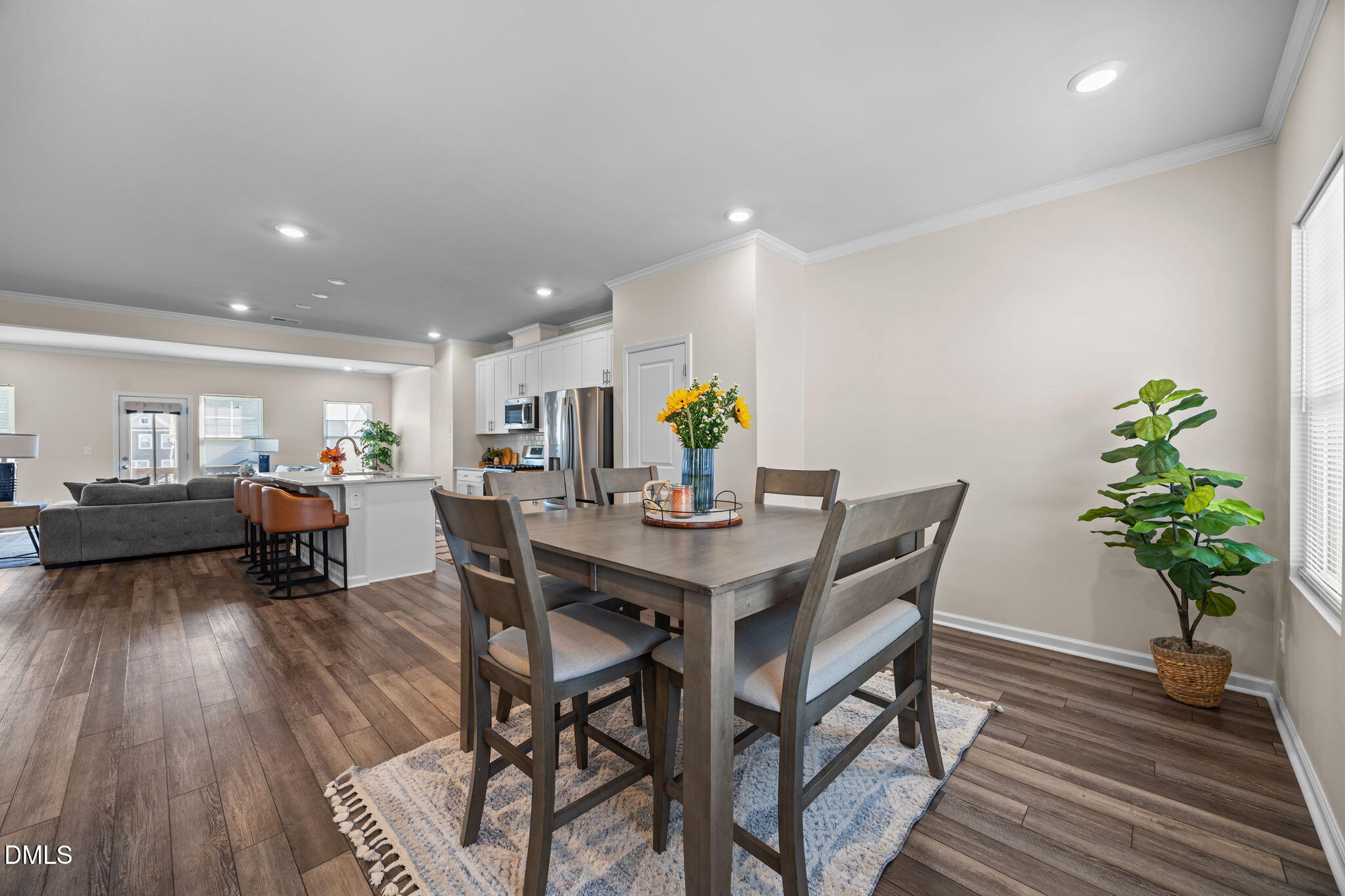 6414 Nurture Avenue Raleigh, NC 27616 - Photo 18 of 36 a view of a dining room with furniture and wooden floor