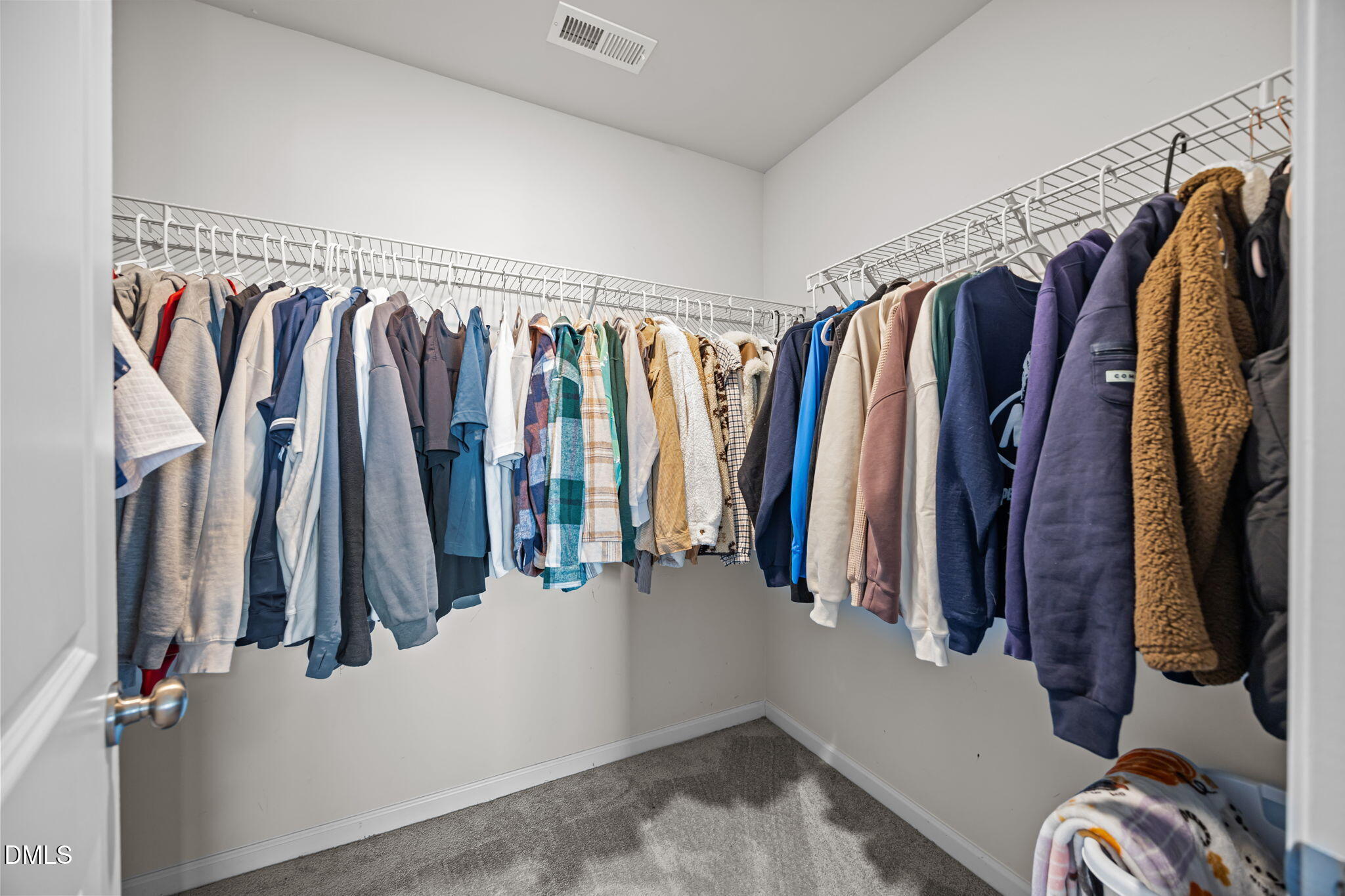 6414 Nurture Avenue Raleigh, NC 27616 - Photo 23 of 36 a view of walk in closet with clothes and shoes