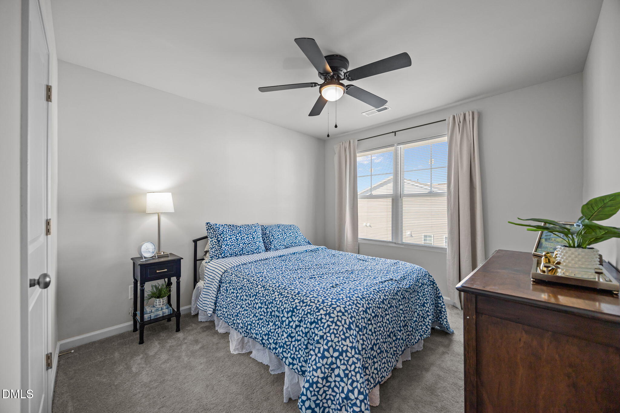 6414 Nurture Avenue Raleigh, NC 27616 - Photo 27 of 36 a bedroom with a bed and a window