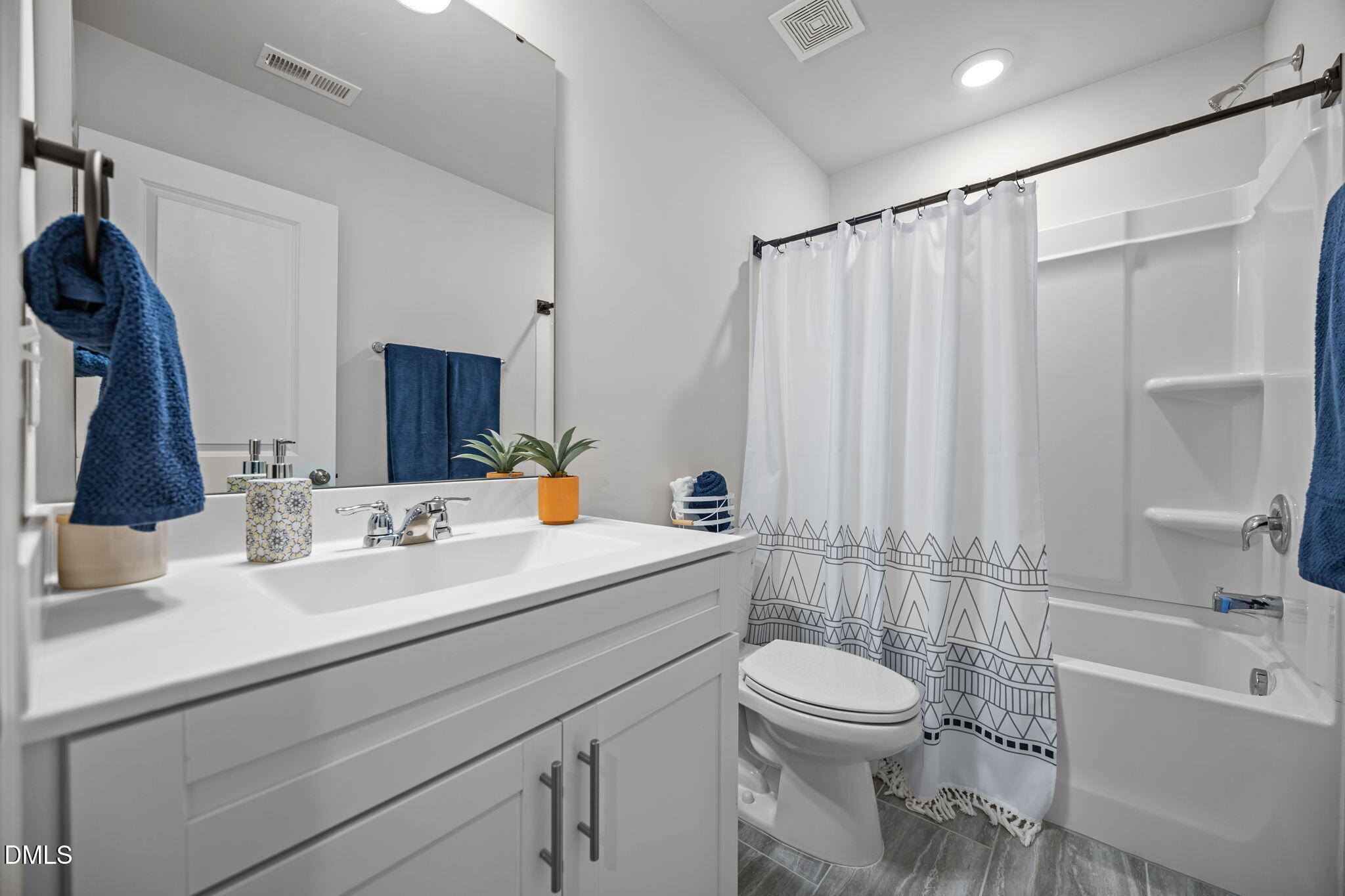 6414 Nurture Avenue Raleigh, NC 27616 - Photo 29 of 36 a bathroom with a sink toilet tub and shower