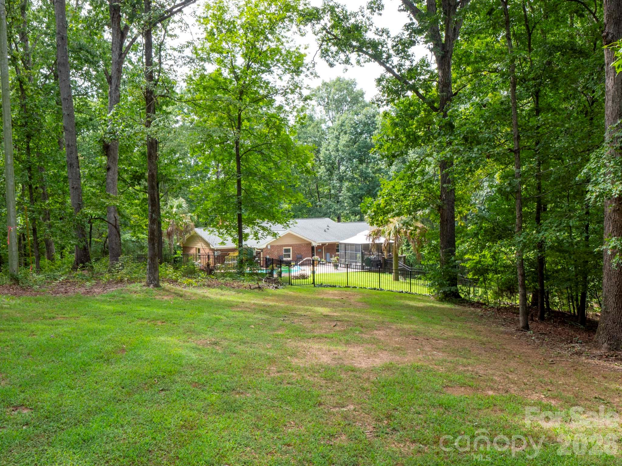 8720 Unionville-Brief Road Monroe, NC 28110 - Photo 11 of 35 a view of a trees in a yard with large trees