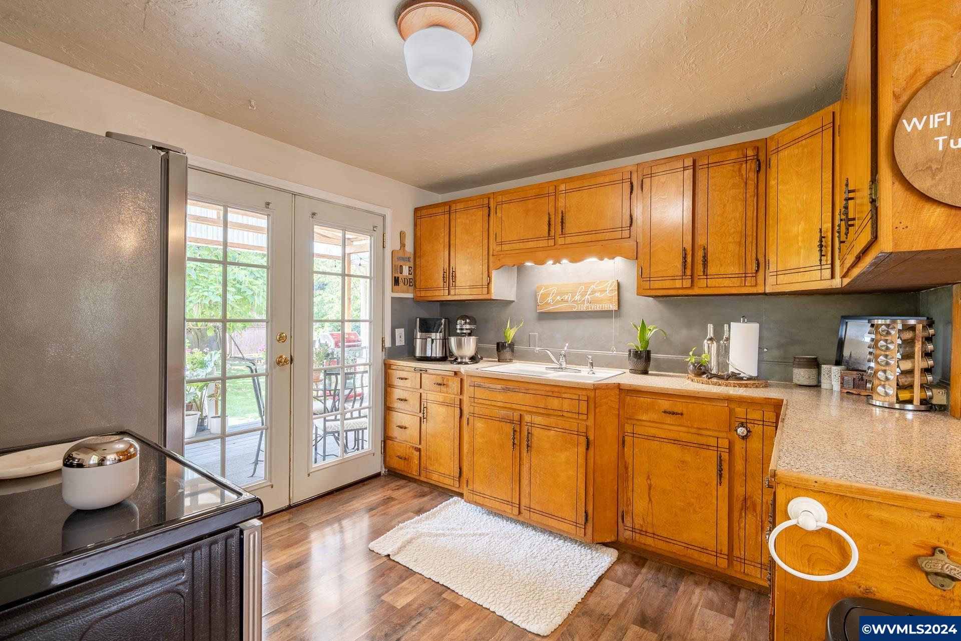 1530 2nd Avenue Albany, OR 97321 - Photo 14 of 35 a kitchen with granite countertop lots of counter top space and wooden floor