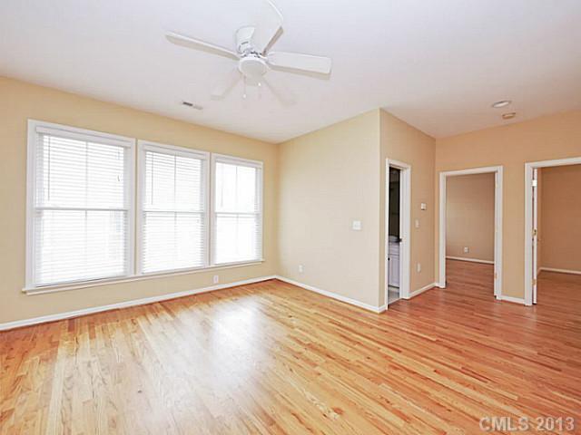 420 Third Baxter Street Fort Mill, SC 29708 - Photo 12 of 16 a view of an empty room with wooden floor and a window