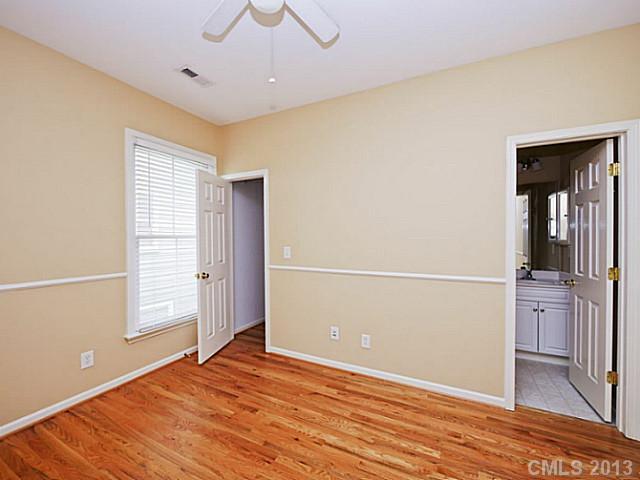 420 Third Baxter Street Fort Mill, SC 29708 - Photo 13 of 16 a view of an empty room with wooden floor and a window