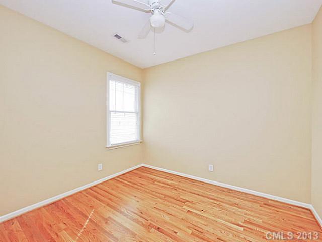 420 Third Baxter Street Fort Mill, SC 29708 - Photo 14 of 16 an empty room with a window and a ceiling fan