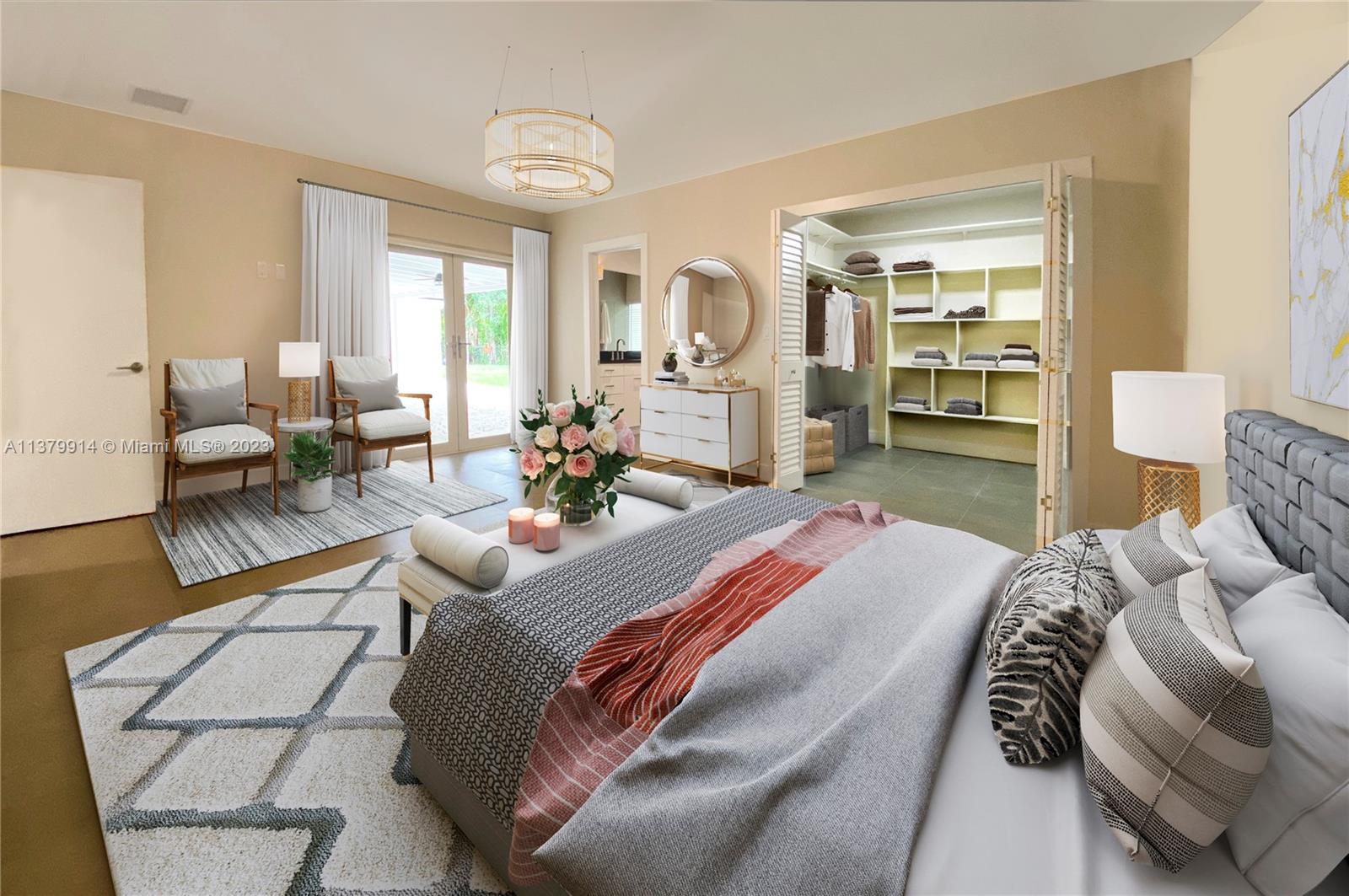 11821 Southwest 81st Road, Unit 11821 Pinecrest, FL 33156 - Photo 9 of 14 a bedroom with a bed a table and chair