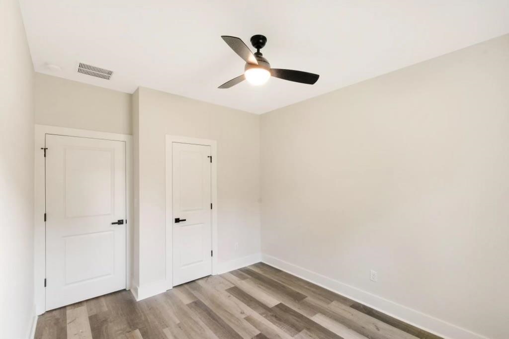 4977 Chevron Road Memphis, TN 38118 - Photo 14 of 19 a view of empty room with wooden floor