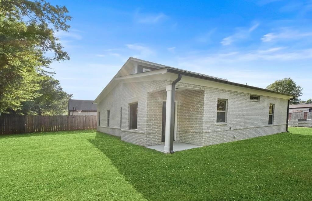 4977 Chevron Road Memphis, TN 38118 - Photo 16 of 19 a view of a house with a yard