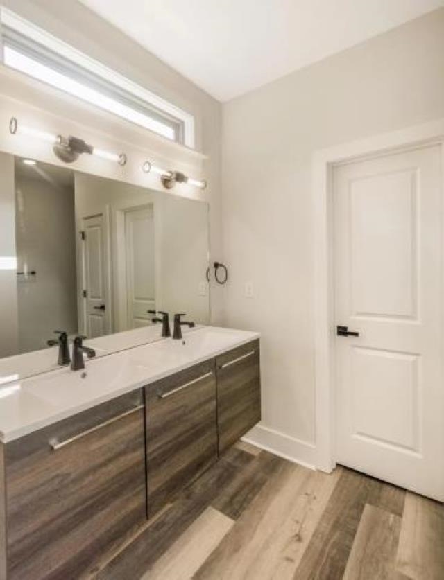 4977 Chevron Road Memphis, TN 38118 - Photo 19 of 19 a bathroom with a double vanity sink and mirror