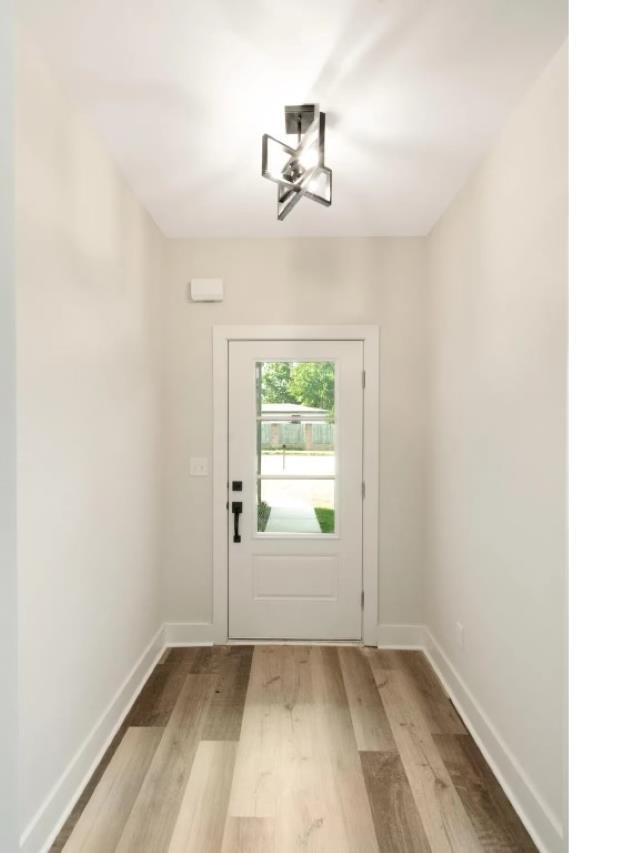 4977 Chevron Road Memphis, TN 38118 - Photo 2 of 19 a view of empty room with wooden floor