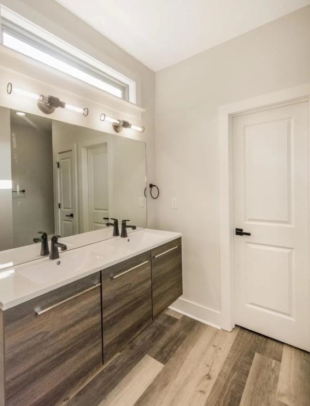 4977 Chevron Road Memphis, TN 38118 - Photo 6 of 19 a bathroom with a double vanity sink and mirror