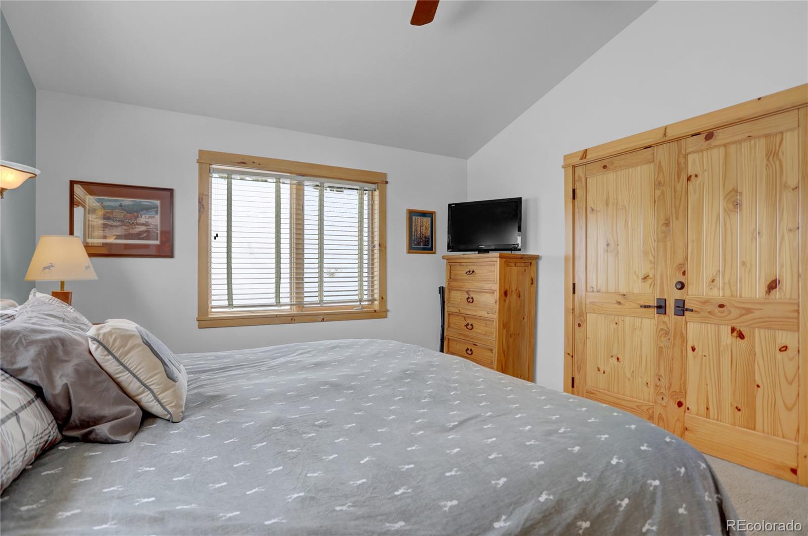 20 County Road 523 Tabernash, CO 80478 - Photo 13 of 32 a bedroom with a bed and a flat screen tv