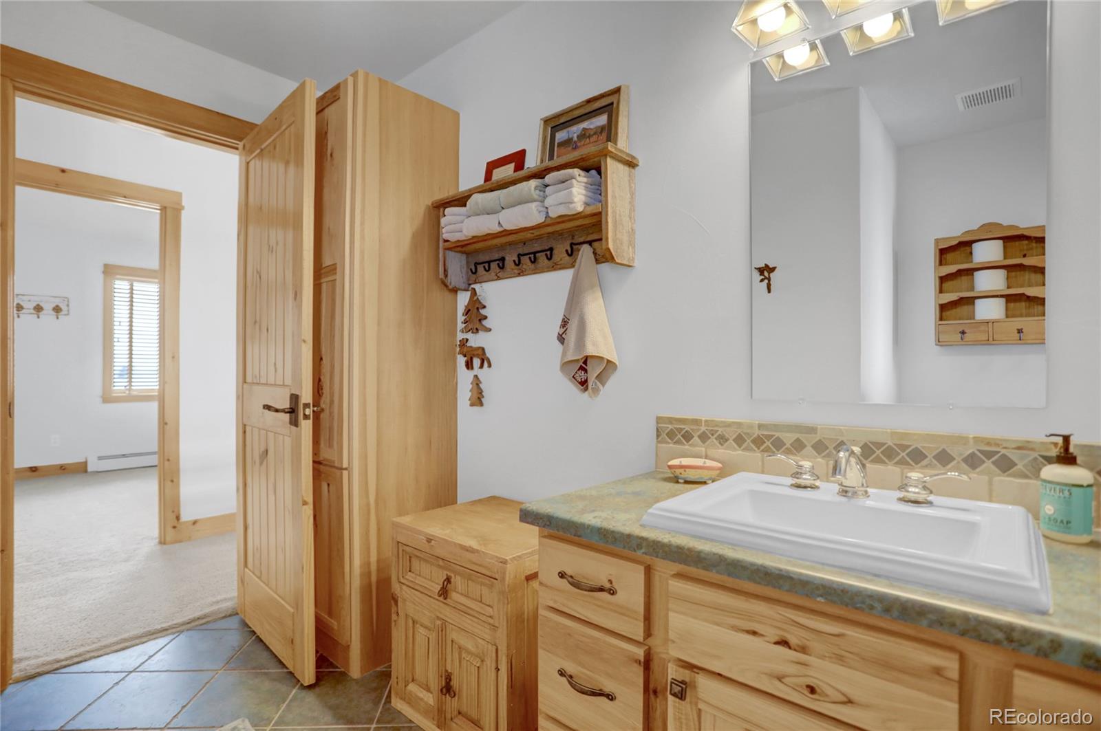 20 County Road 523 Tabernash, CO 80478 - Photo 16 of 32 a bathroom with a sink and a mirror