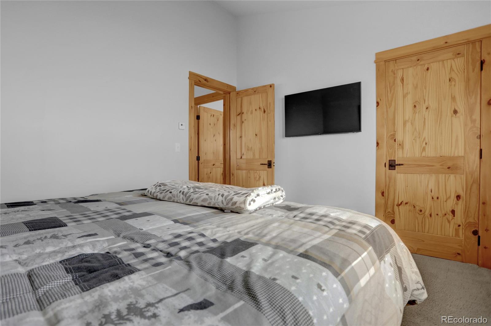 20 County Road 523 Tabernash, CO 80478 - Photo 23 of 32 a bedroom with a bed and a television