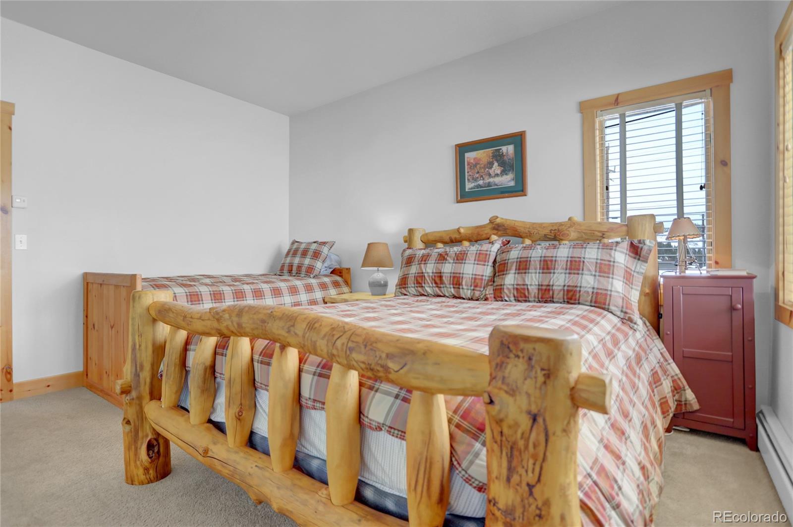 20 County Road 523 Tabernash, CO 80478 - Photo 25 of 32 a bedroom with a bed and wooden floor