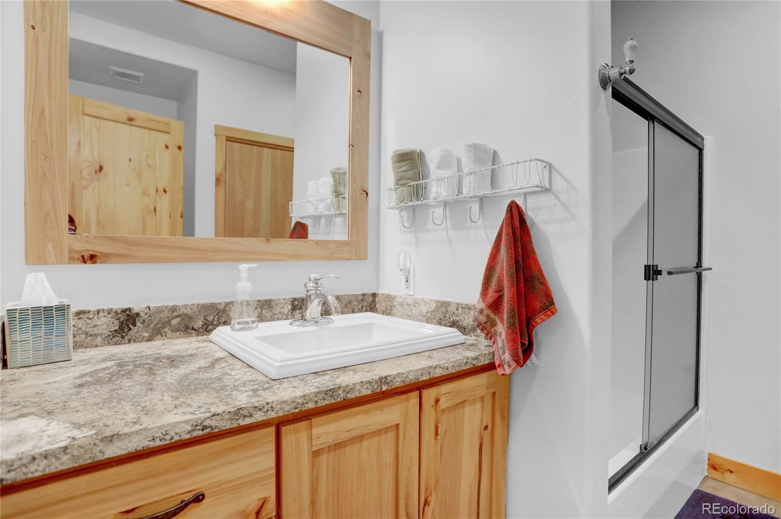 20 County Road 523 Tabernash, CO 80478 - Photo 27 of 32 a bathroom with a sink and a mirror