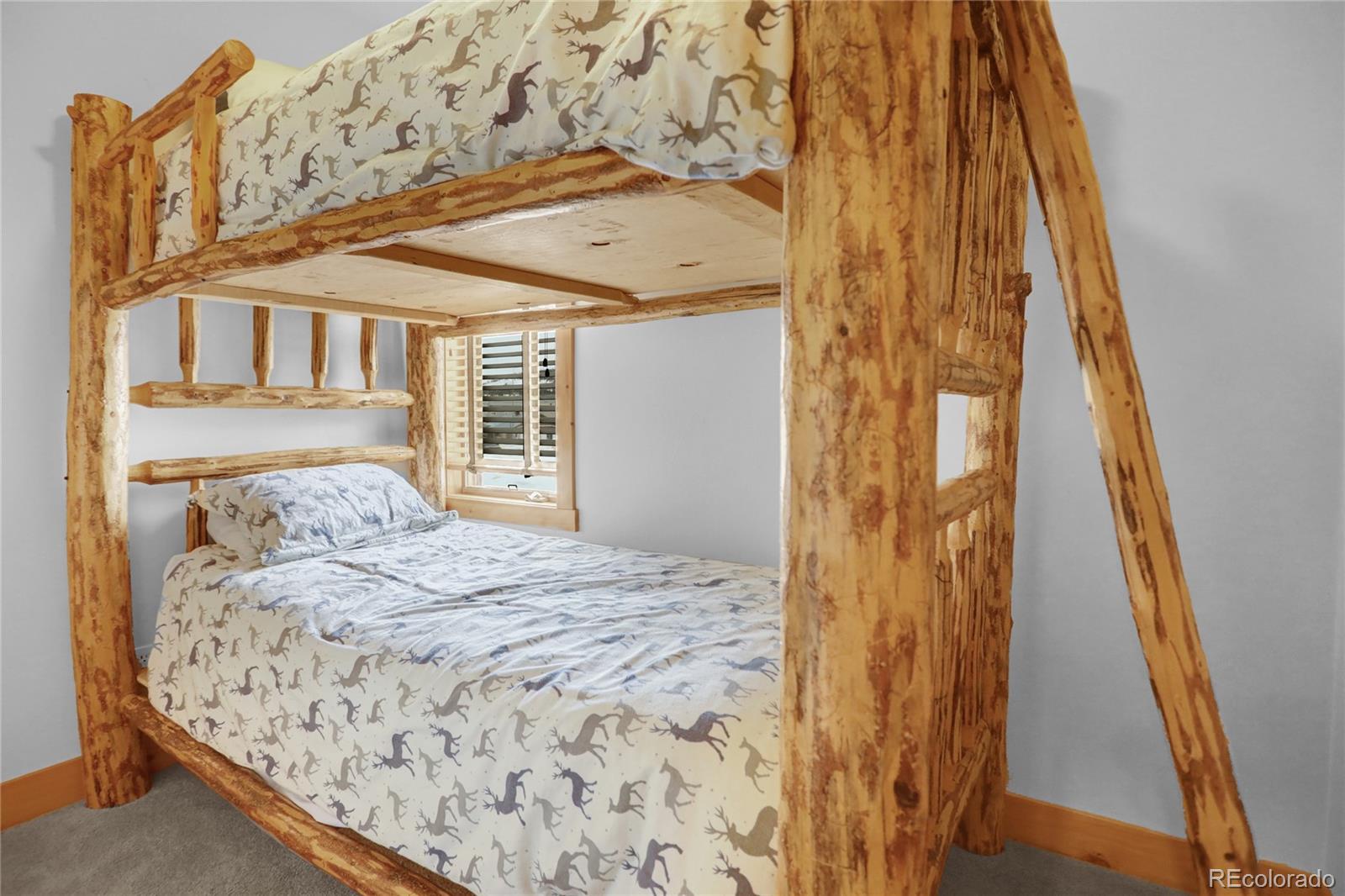 20 County Road 523 Tabernash, CO 80478 - Photo 29 of 32 a bedroom with a bed and wooden floor