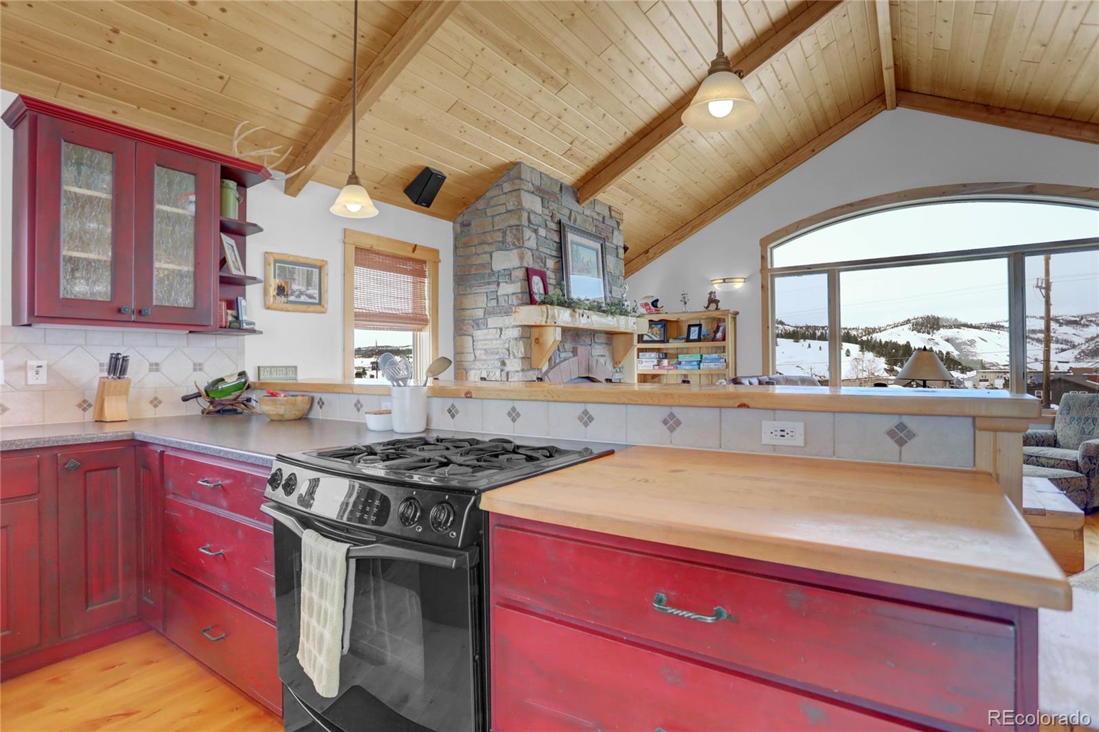 20 County Road 523 Tabernash, CO 80478 - Photo 7 of 32 a kitchen with a stove a sink and a wooden cabinets